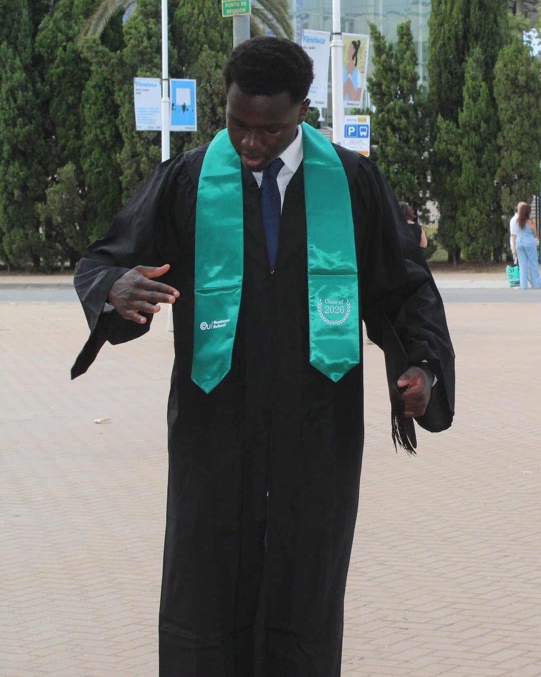 Hawi Oyugi in his Class of 2026 graduation gown